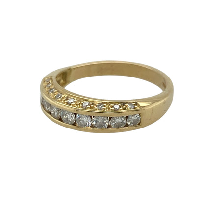 This pre-owned 18ct yellow gold diamond band ring is a distinctive three-row design, featuring approximately 0.45ct of diamond content across the front.

Design: Featuring a main central row of diamonds with an additional diamond row above and below, this ring has a layered three-row design finished in warm 18ct yellow gold.
Material: Made from 18-carat yellow gold.
Gemstone Detail: Approximately 0.45ct of diamond content set in total across three rows.