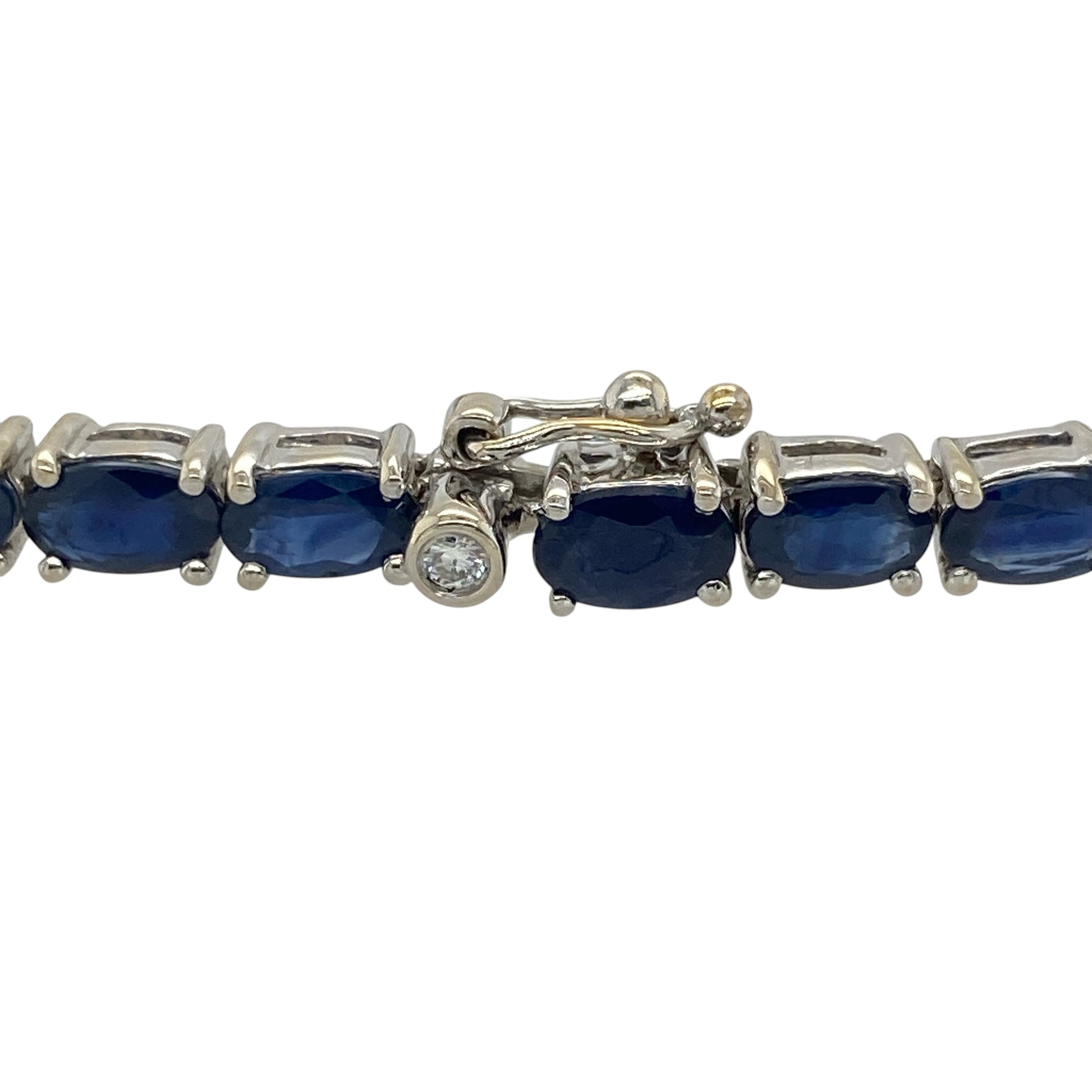 This pre-owned 18ct white gold diamond and sapphire bracelet is a classic gemstone design, featuring oval sapphires with diamond detailing.

Design: Featuring oval sapphire stones with diamond detailing, this bracelet combines rich blue tones with the bright finish of 18ct white gold.
Material: Made from 18-carat white gold.
Gemstone Detail: Oval sapphire stones each measuring approximately 5mm by 3mm with diamond detailing.
Bracelet Detail: Diamond and sapphire set bracelet design.