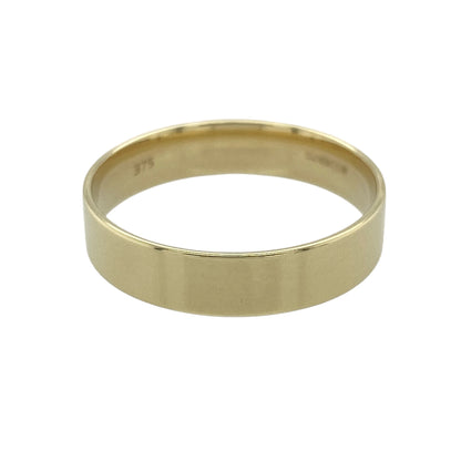 This pre-owned 9ct yellow gold flat wedding band ring is a timeless design, featuring a simple 5mm wide profile.

Design: Featuring a classic flat wedding band design, this ring has a clean, simple profile finished in warm 9ct yellow gold.
Material: Made from 9-carat yellow gold.
Ring Detail: Band measures approximately 5mm wide.
Size & Weight: Ring size V. Total weight 3.30 grams.

A classic pre-owned 9ct yellow gold wedding band ring, perfect as a traditional wedding ring or for everyday wear.