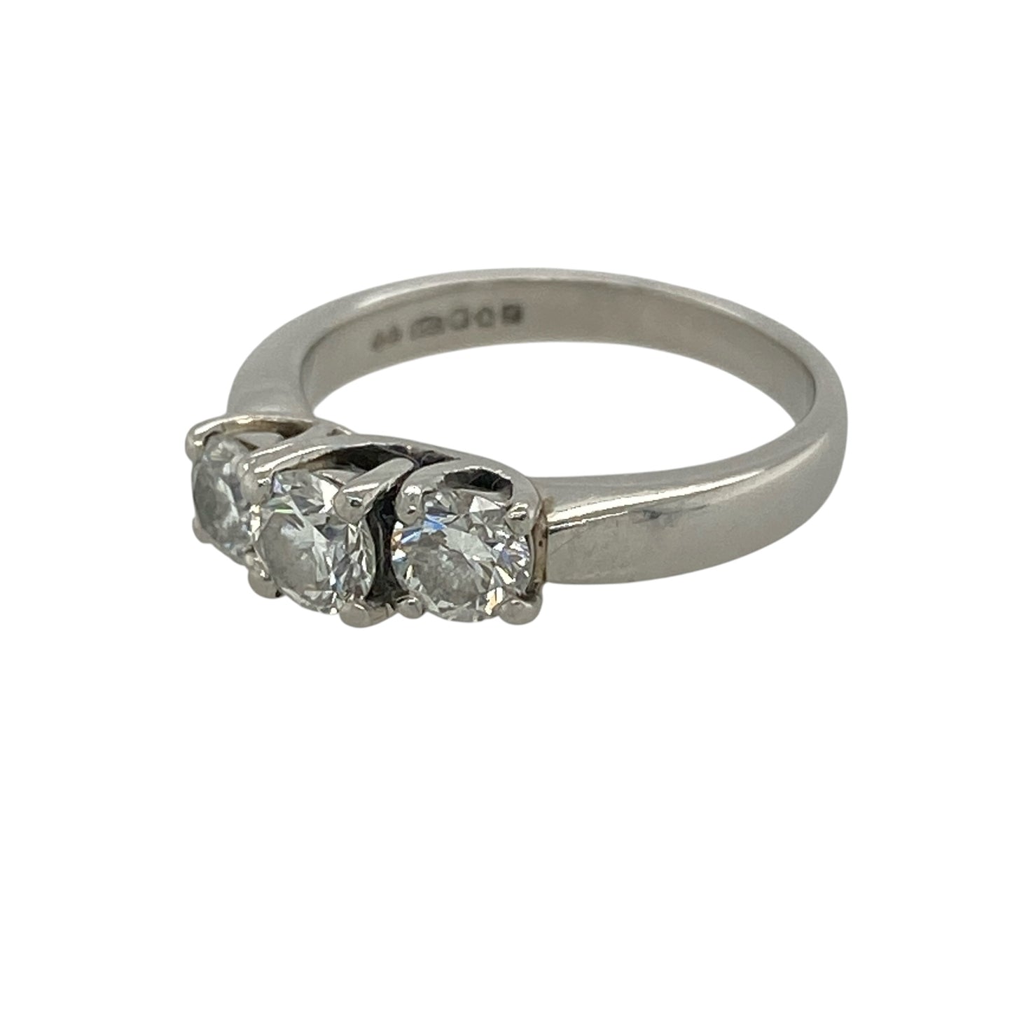 This pre-owned platinum diamond trilogy ring is a timeless design, featuring three diamonds with approximately 0.67ct of diamond content in total.

Design: Featuring a classic three-stone trilogy setting, this ring has a larger centre diamond complemented by a diamond on either side.
Material: Made from platinum.
Gemstone Detail: Approximately 0.67ct of diamond content set in total, with the centre diamond weighing approximately 0.25ct.
Ring Detail: Classic three-stone trilogy design.