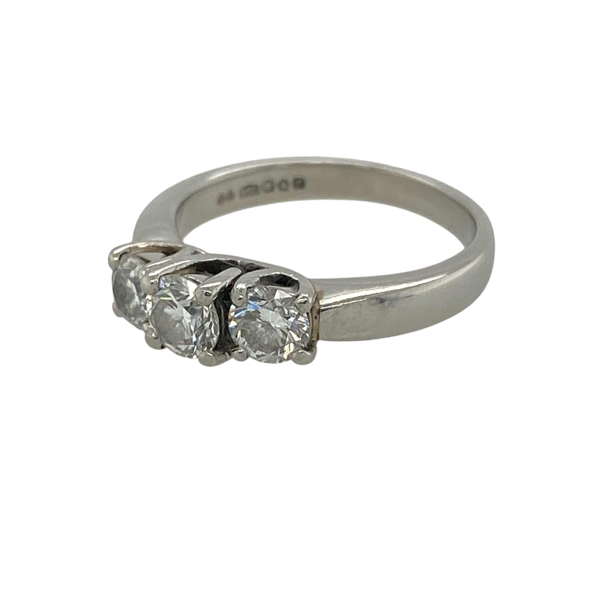 This pre-owned platinum diamond trilogy ring is a timeless design, featuring three diamonds with approximately 0.67ct of diamond content in total.

Design: Featuring a classic three-stone trilogy setting, this ring has a larger centre diamond complemented by a diamond on either side.
Material: Made from platinum.
Gemstone Detail: Approximately 0.67ct of diamond content set in total, with the centre diamond weighing approximately 0.25ct.
Ring Detail: Classic three-stone trilogy design.