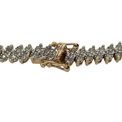 This pre-owned 9ct yellow gold diamond bracelet is a statement design, featuring approximately 1ct of diamond content set throughout.

Design: Featuring diamond detailing across a 5mm wide link design, this bracelet combines a substantial profile with the warm finish of 9ct yellow gold.
Material: Made from 9-carat yellow gold.
Gemstone Detail: Approximately 1ct of diamond content set in total.
Bracelet Detail: Links measure approximately 5mm wide.