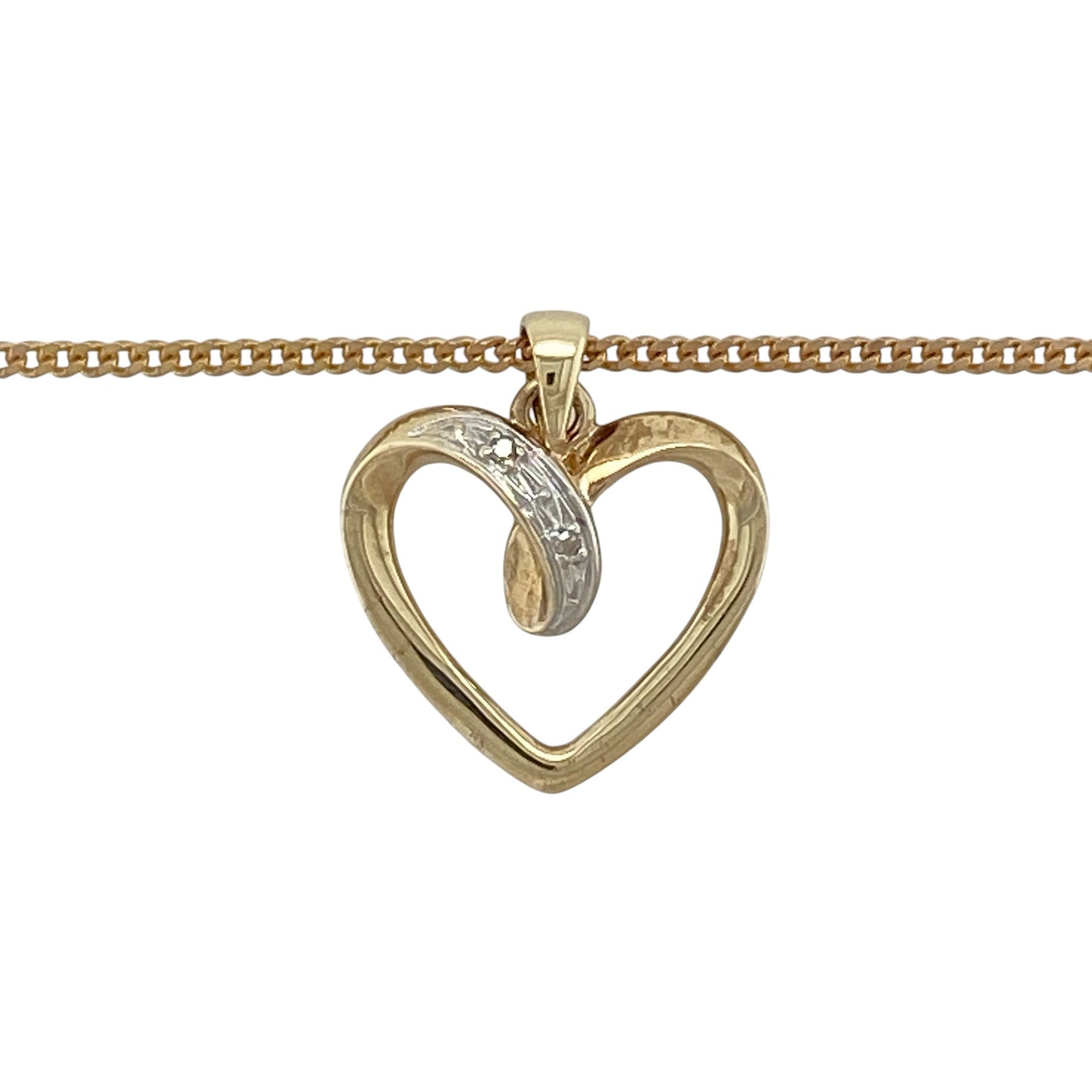 This pre-owned 9ct yellow gold diamond open heart pendant necklace is a classic design, featuring diamond detailing within an open heart shape.

Design: Featuring an open heart-shaped pendant with diamond detailing, this necklace combines a timeless heart design with the warm finish of 9ct yellow gold.
Material: Made from 9-carat yellow gold.
Gemstone Detail: Open heart pendant set with diamonds.
Pendant Detail: Pendant measures approximately 1.9cm long including the bail.