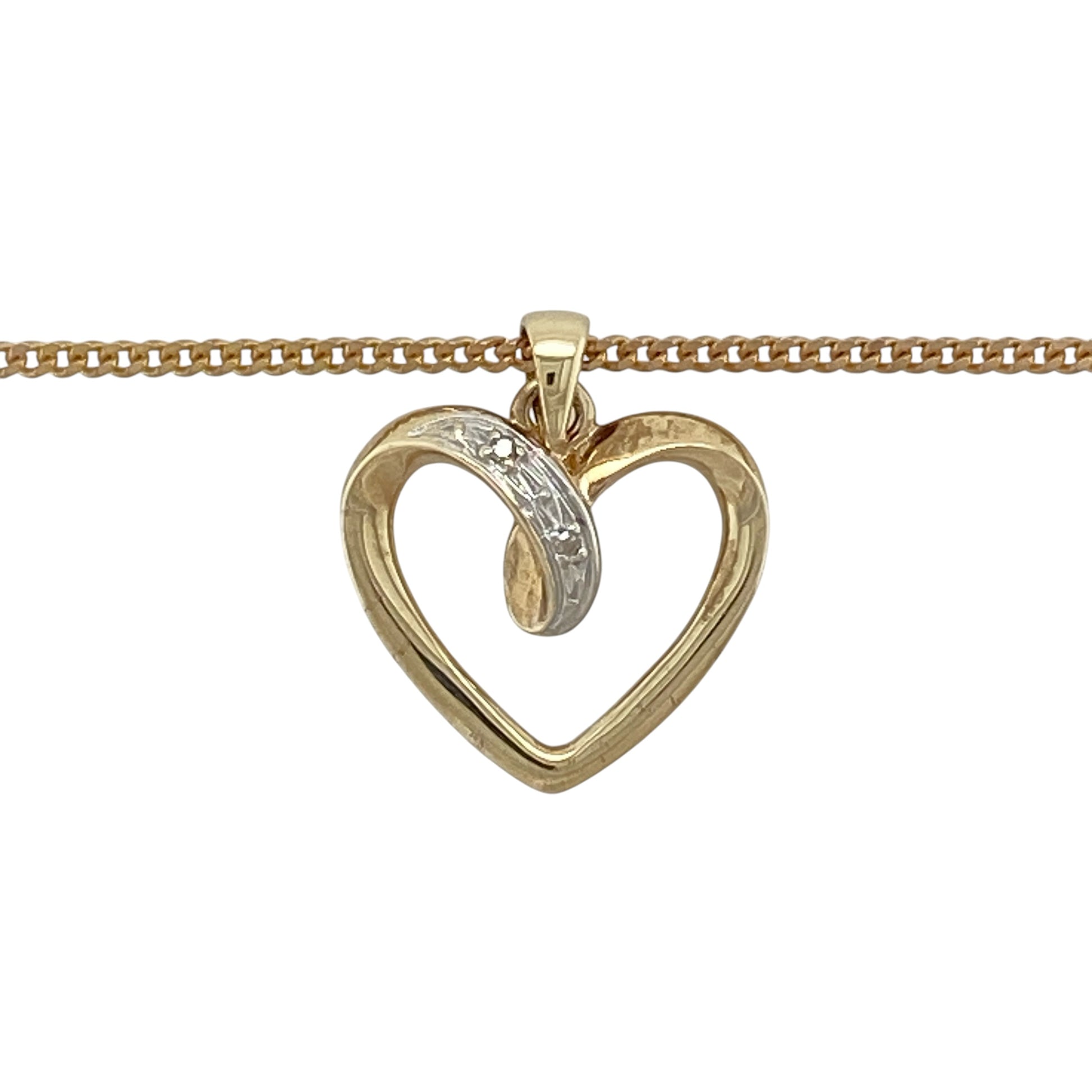 This pre-owned 9ct yellow gold diamond open heart pendant necklace is a classic design, featuring diamond detailing within an open heart shape.

Design: Featuring an open heart-shaped pendant with diamond detailing, this necklace combines a timeless heart design with the warm finish of 9ct yellow gold.
Material: Made from 9-carat yellow gold.
Gemstone Detail: Open heart pendant set with diamonds.
Pendant Detail: Pendant measures approximately 1.9cm long including the bail.