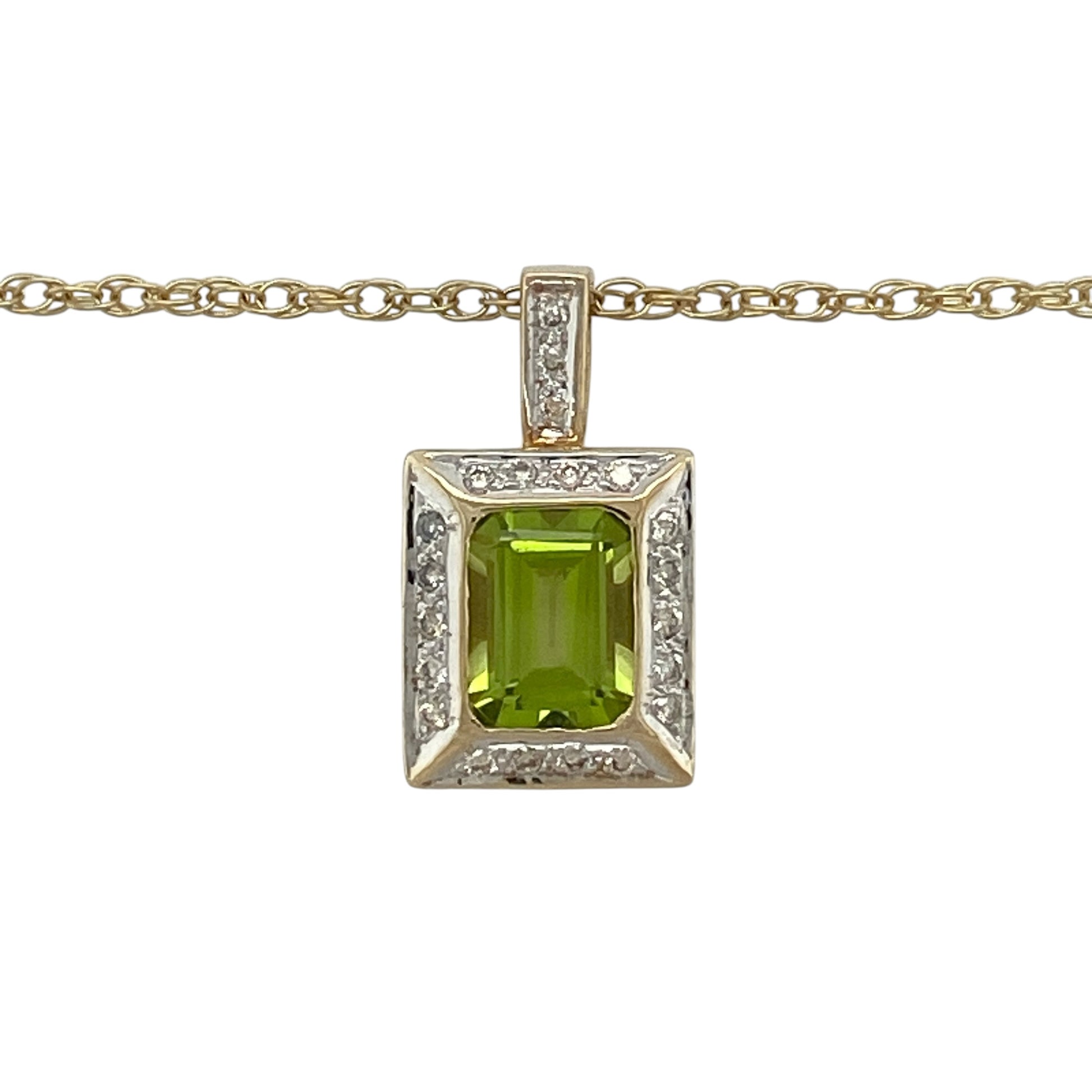 This pre-owned 9ct yellow gold diamond and peridot rectangle pendant necklace is a colourful gemstone design, featuring a rectangular peridot with diamond detailing.

Design: Featuring a rectangular peridot with diamond detailing, this pendant is suspended from an 18-inch Prince of Wales chain and finished in warm 9ct yellow gold.
Material: Made from 9-carat yellow gold.
Gemstone Detail: Rectangular peridot stone measuring approximately 8mm by 6mm with diamond detailing.