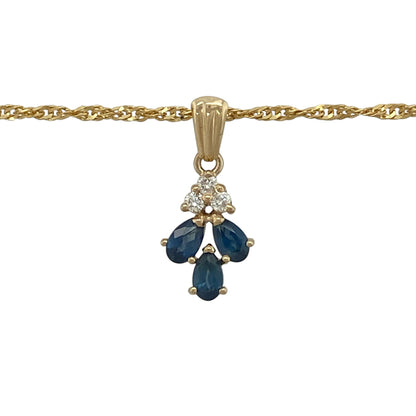 This pre-owned 9ct yellow gold diamond and sapphire pendant necklace is a decorative gemstone design, featuring three teardrop sapphires with diamond detailing.

Design: Featuring three teardrop-shaped sapphires with three diamonds set above, this pendant is suspended from an 18-inch Singapore chain and finished in warm 9ct yellow gold.
Material: Made from 9-carat yellow gold.
Gemstone Detail: Three teardrop sapphire stones with three diamonds set above.