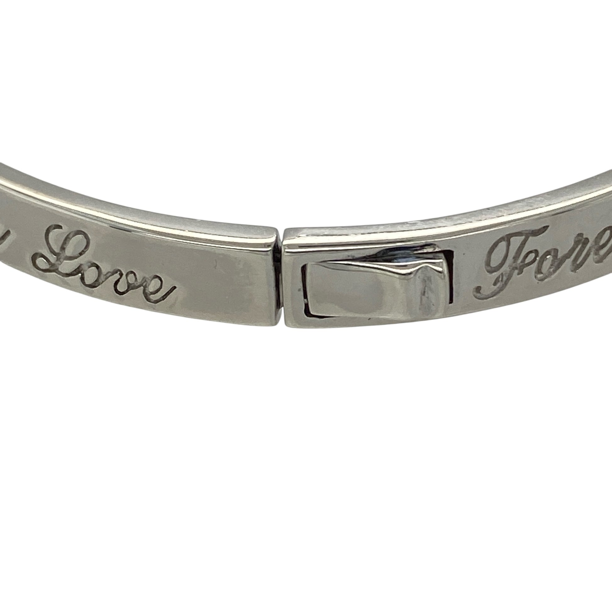 This pre-owned Clogau ‘Forever Love’ bangle is a meaningful two-tone design, combining 925 silver with signature 9ct rose gold detailing.

Design: Featuring Clogau’s ‘Forever Love’ design, this bangle combines polished silver with contrasting rose gold detailing for a distinctive two-tone finish.
Material: Made from 925 sterling silver with 9-carat rose gold detailing.
Bangle Detail: Bangle measures approximately 5mm wide with a diameter of approximately 6cm.
Size & Weight: Total weight 17.60 grams.