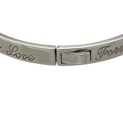 This pre-owned Clogau ‘Forever Love’ bangle is a meaningful two-tone design, combining 925 silver with signature 9ct rose gold detailing.

Design: Featuring Clogau’s ‘Forever Love’ design, this bangle combines polished silver with contrasting rose gold detailing for a distinctive two-tone finish.
Material: Made from 925 sterling silver with 9-carat rose gold detailing.
Bangle Detail: Bangle measures approximately 5mm wide with a diameter of approximately 6cm.
Size & Weight: Total weight 17.60 grams.