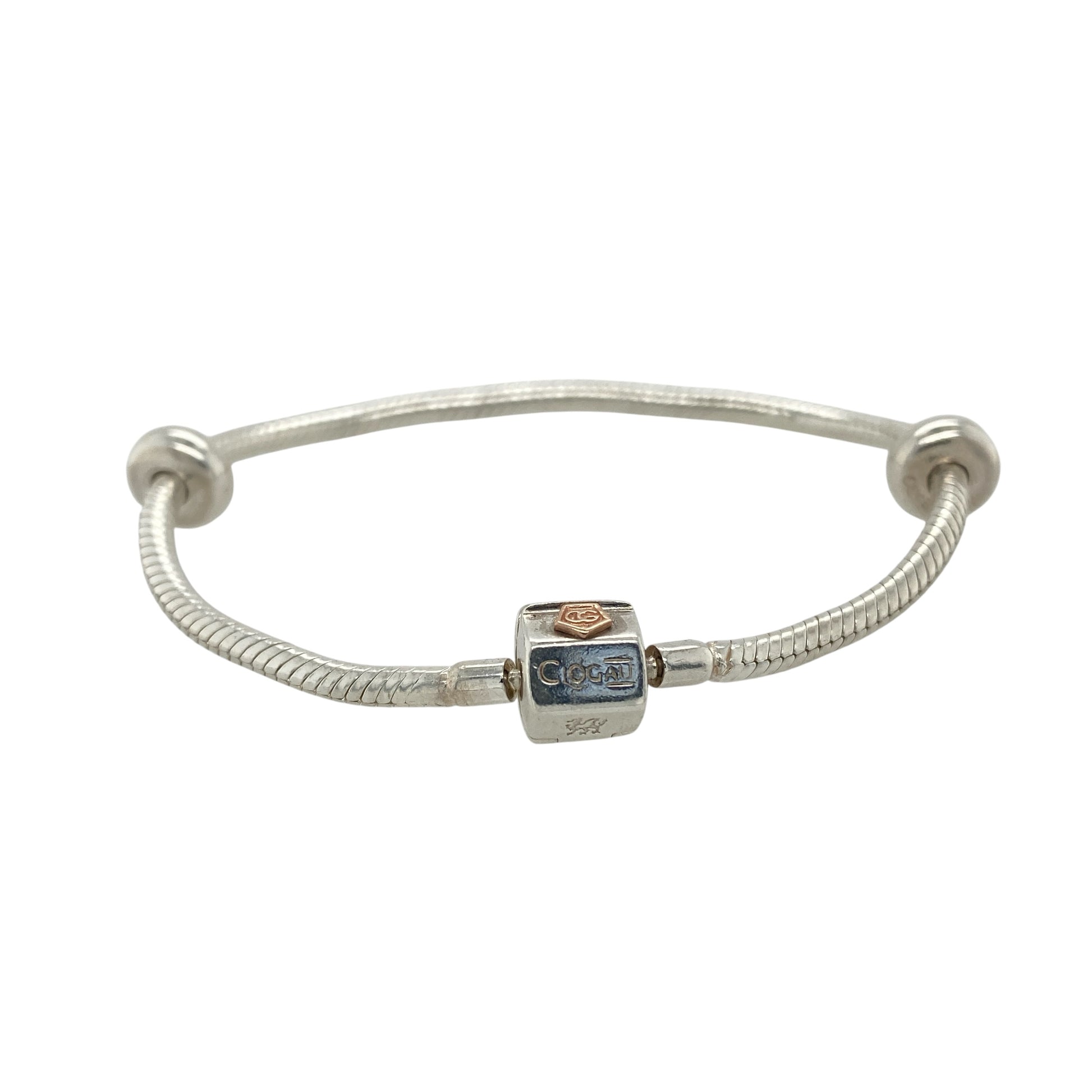 This pre-owned Clogau charm bracelet is a beautiful sterling silver and 9ct rose gold design, complete with two stoppers ready for adding your favourite charms.

Design: Featuring a classic Clogau charm bracelet design, this piece combines polished sterling silver with signature 9ct rose gold detailing for a timeless two-tone finish. Complete with two stoppers to help keep charms securely positioned, the bracelet can be personalised with a selection of meaningful charms to create a unique piece of jewellery