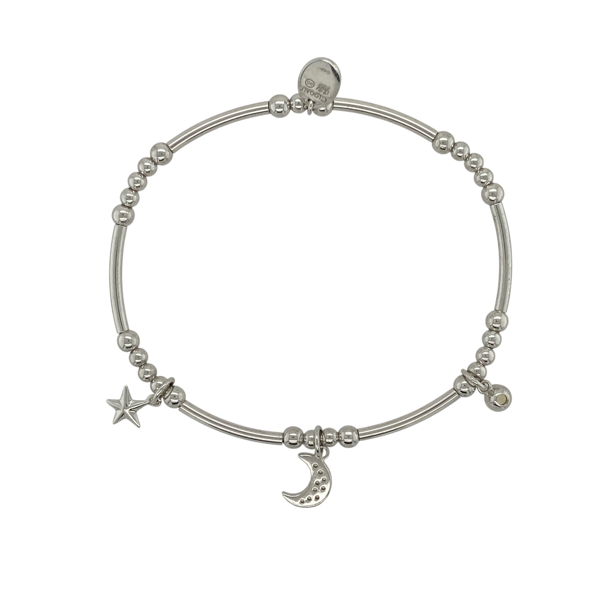 This pre-owned Clogau moon and star stretchy bracelet is a charming two-tone design, combining 925 silver with 9ct rose gold and white topaz detailing.

Design: Featuring a moon and star design with contrasting rose gold detailing and white topaz, this Clogau stretchy bracelet has a distinctive celestial-inspired style.
Material: Made from 925 sterling silver with 9-carat rose gold detailing.
Gemstone Detail: Set with white topaz.
Bracelet Detail: Stretchy bracelet featuring a moon and star design.