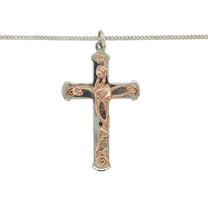 This pre-owned Clogau Tree of Life cross pendant necklace is a meaningful two-tone design, combining 925 silver with signature 9ct rose gold detailing.

Design: Featuring Clogau’s iconic Tree of Life detailing within a cross design, this pendant combines polished silver with contrasting rose gold accents and is paired with an 18-inch silver curb chain.
Material: Pendant made from 925 sterling silver with 9-carat rose gold detailing. The silver curb chain is not Clogau.
