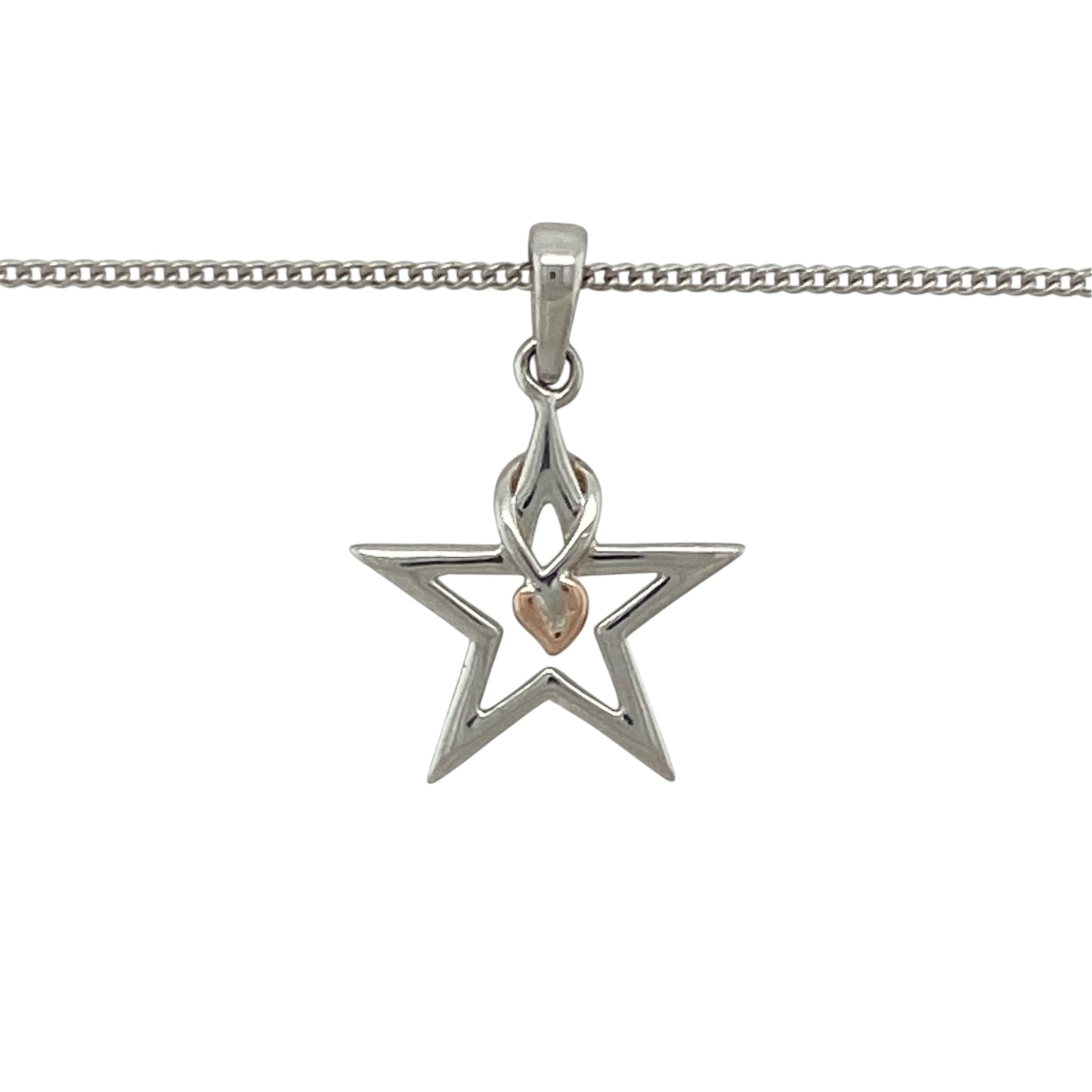 This pre-owned Clogau ‘Starlight’ pendant necklace is a distinctive two-tone design, featuring a star shape with signature Tree of Life detailing.

Design: Featuring a star-shaped ‘Starlight’ pendant with Clogau’s iconic Tree of Life detailing, this necklace combines polished silver with contrasting 9ct rose gold accents.
Material: Made from 925 sterling silver with 9-carat rose gold detailing.
Pendant Detail: Star-shaped pendant measures approximately 2.1cm long including the bail.