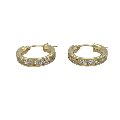 These pre-owned 9ct yellow gold cubic zirconia hoop creole earrings are a classic design, featuring stone-set detailing in warm yellow gold.

Design: Featuring a classic hoop creole design with cubic zirconia detailing, these earrings are finished in warm 9ct yellow gold.
Material: Made from 9-carat yellow gold.
Gemstone Detail: Set with cubic zirconia stones.
Earring Detail: Hoop creole earring design.
Size & Weight: Total weight 2.60 grams.