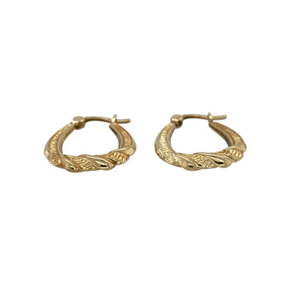 These pre-owned 9ct yellow gold patterned twisted oval creole earrings are a decorative design, featuring a combination of twisted and patterned detailing.

Design: Featuring an oval creole shape with twisted and patterned detailing, these earrings have a decorative finish in warm 9ct yellow gold.
Material: Made from 9-carat yellow gold.
Earring Detail: Patterned twisted oval creole earring design.
Size & Weight: Total weight 1 gram.