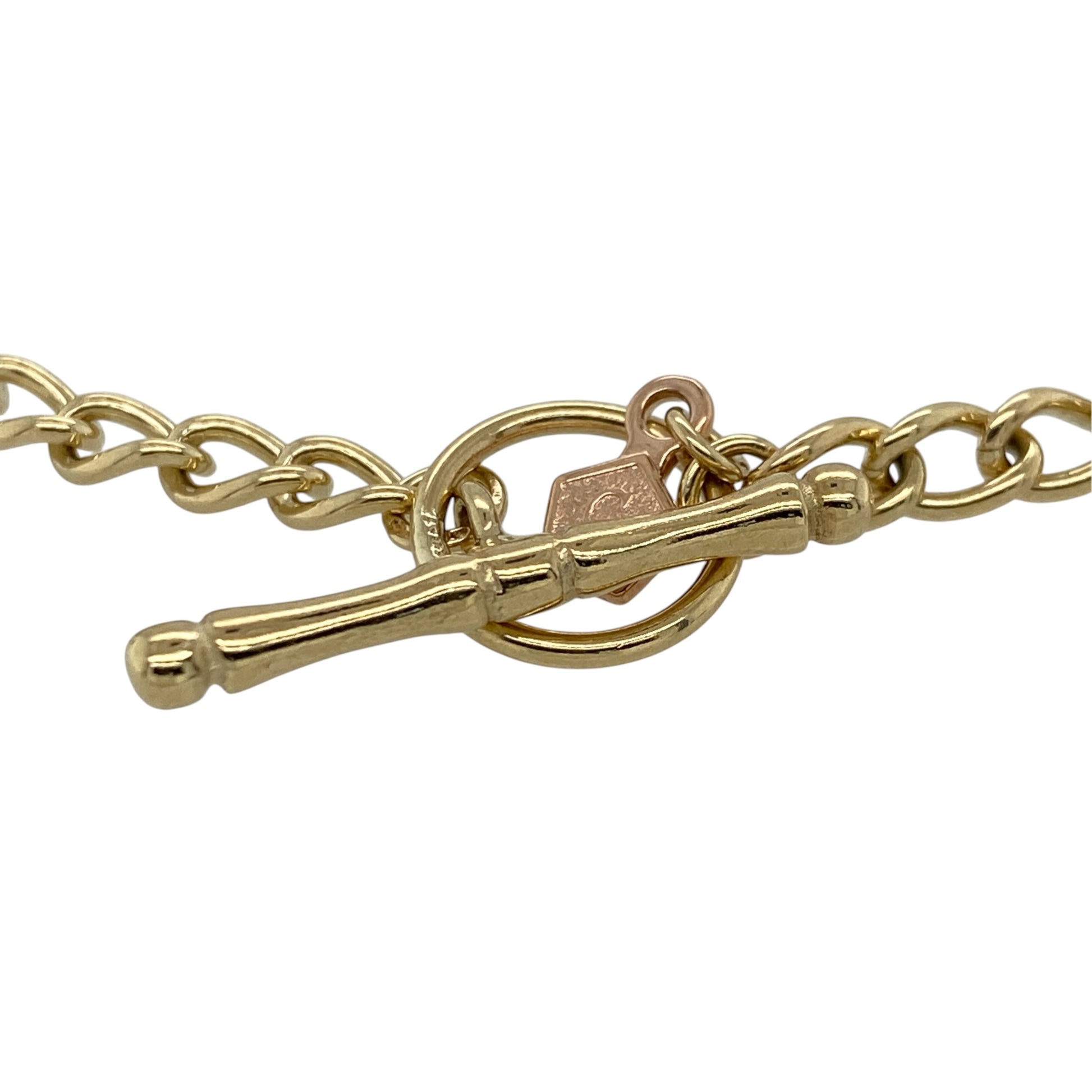 This pre-owned 9ct yellow and rose gold Clogau charm T-bar bracelet is a substantial two-tone design, featuring four distinctive Clogau charms.

Design: Featuring a classic T-bar fastening with four decorative Clogau charms, this bracelet combines warm yellow gold with contrasting rose gold detailing.
Material: Made from 9-carat yellow and rose gold.
Bracelet Detail: Features four Clogau charms including a daffodil, daisy, teardrop Tree of Life and round Tree of Life design.