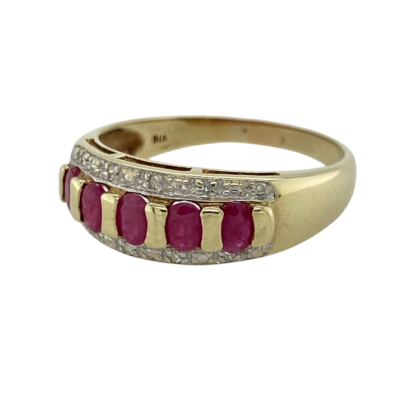 This pre-owned 9ct yellow gold diamond and ruby band ring is a colourful gemstone design, featuring five oval rubies with diamond detailing.

Design: Featuring five oval ruby stones set across the front with small diamonds above and below, this band ring combines rich red tones with the warm finish of 9ct yellow gold.
Material: Made from 9-carat yellow gold.
Gemstone Detail: Five oval ruby stones each measuring approximately 4mm by 3mm, with small diamonds set above and below.