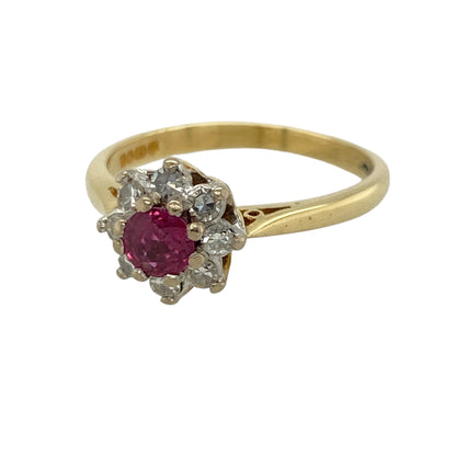 This pre-owned 18ct yellow gold diamond and ruby cluster ring is a classic gemstone design, featuring a central ruby surrounded by diamonds.

Design: Featuring a round ruby centre stone surrounded by a cluster of diamonds, this ring combines rich red tones with the warm finish of 18ct yellow gold.
Material: Made from 18-carat yellow gold.
Gemstone Detail: Round ruby measuring approximately 4mm in diameter, surrounded by approximately 0.20ct of diamond content in total.