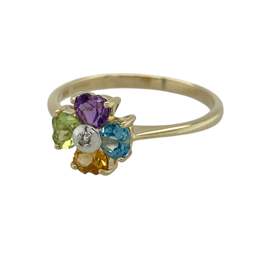 This pre-owned 9ct yellow gold diamond and gemstone flower ring is a colourful floral design, featuring a mix of gemstones forming the petals with a diamond at the centre.

Design: Featuring a flower-shaped design with colourful gemstone petals and a small diamond set in the centre, this ring is finished in warm 9ct yellow gold.
Material: Made from 9-carat yellow gold.
Gemstone Detail: Set with amethyst, blue topaz, citrine and peridot stones forming the flower petals, with a small diamond in the centre.