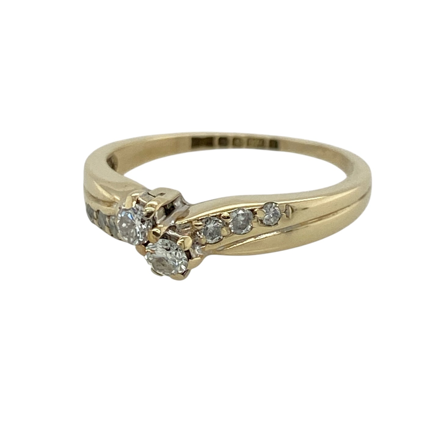 This pre-owned 9ct yellow gold diamond double twist ring is an elegant design, featuring a double twist setting with diamond-set shoulders.

Design: Featuring a double twist design with diamonds extending along the shoulders, this ring has a flowing style finished in warm 9ct yellow gold.
Material: Made from 9-carat yellow gold.
Gemstone Detail: Set with diamonds, including diamond detailing along the shoulders.
Ring Detail: Double twist ring design with diamond-set shoulders.