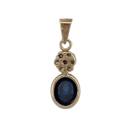 This pre-owned 9ct yellow gold diamond and sapphire pendant is a classic gemstone design, featuring a large oval sapphire with a diamond cluster above.

Design: Featuring an oval sapphire with a decorative diamond cluster set above, this pendant combines rich blue tones with the warm finish of 9ct yellow gold.
Material: Made from 9-carat yellow gold.
Gemstone Detail: Oval sapphire measuring approximately 10mm by 8mm with a diamond cluster set above.
Pendant Detail: Bail measures approximately 6mm by 4mm.