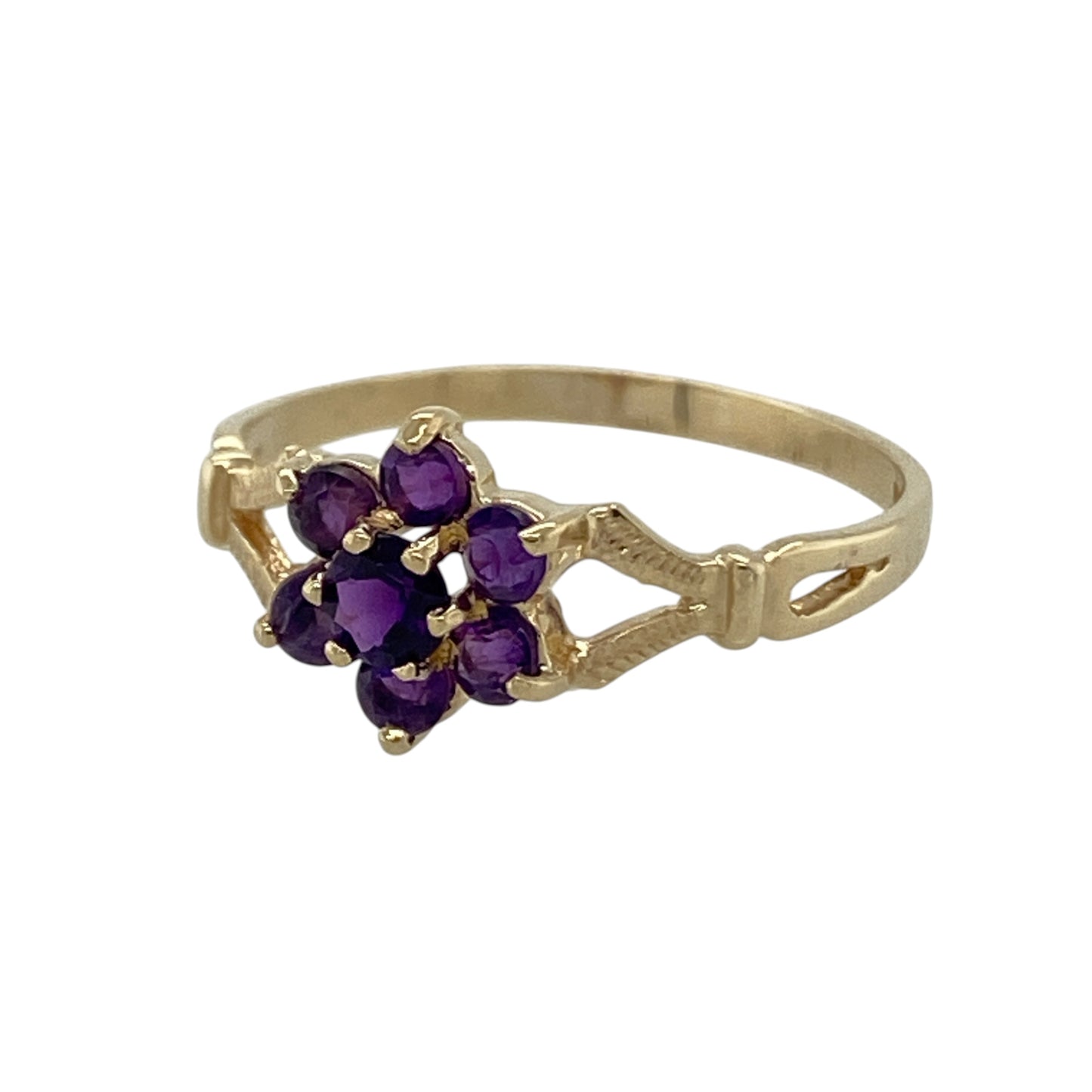 This pre-owned 9ct yellow gold amethyst flower cluster ring is a colourful floral design, featuring amethyst stones arranged in a decorative flower-shaped cluster.

Design: Featuring a flower-shaped cluster design set with amethyst stones, this ring combines rich purple tones with the warm finish of 9ct yellow gold.
Material: Made from 9-carat yellow gold.
Gemstone Detail: Set with amethyst stones in a flower cluster arrangement.
Ring Detail: Front of the ring measures approximately 8mm high.