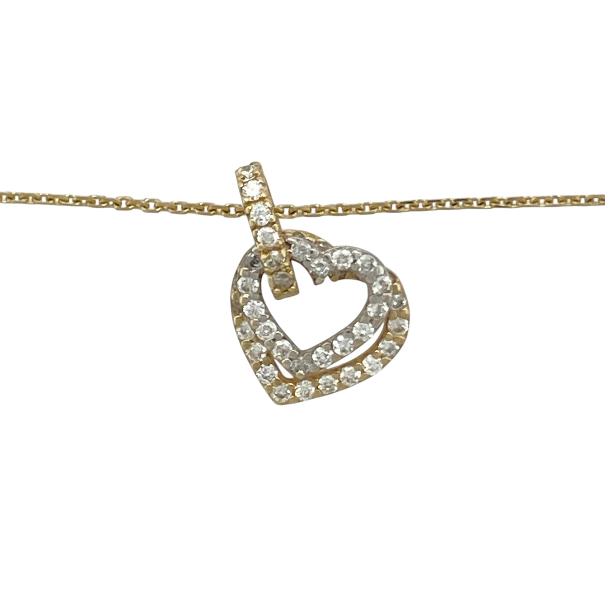 This pre-owned 14ct yellow and white gold cubic zirconia double heart pendant necklace is a romantic two-tone design, featuring two heart motifs with stone-set detailing.

Design: Featuring a double heart pendant with cubic zirconia detailing, this necklace combines yellow and white gold for a contrasting two-tone finish and is suspended from an 18-inch trace chain.
Material: Made from 14-carat yellow and white gold.
Gemstone Detail: Set with cubic zirconia stones.