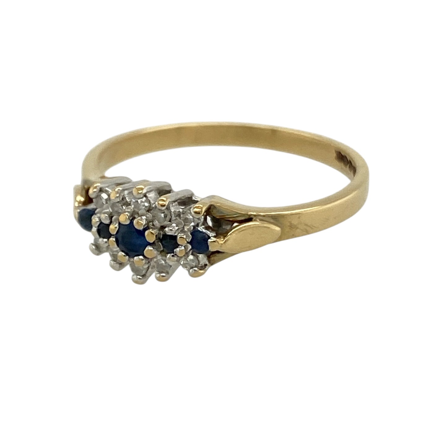 This pre-owned 18ct yellow gold diamond and sapphire cluster ring is a classic gemstone design, featuring five sapphires with diamond detailing.

Design: Featuring five small sapphires set through the centre with diamonds positioned above and below, this cluster ring combines rich blue tones with the warm finish of 18ct yellow gold.
Material: Made from 18-carat yellow gold.
Gemstone Detail: Five small sapphire stones set in the centre with diamonds above and below.