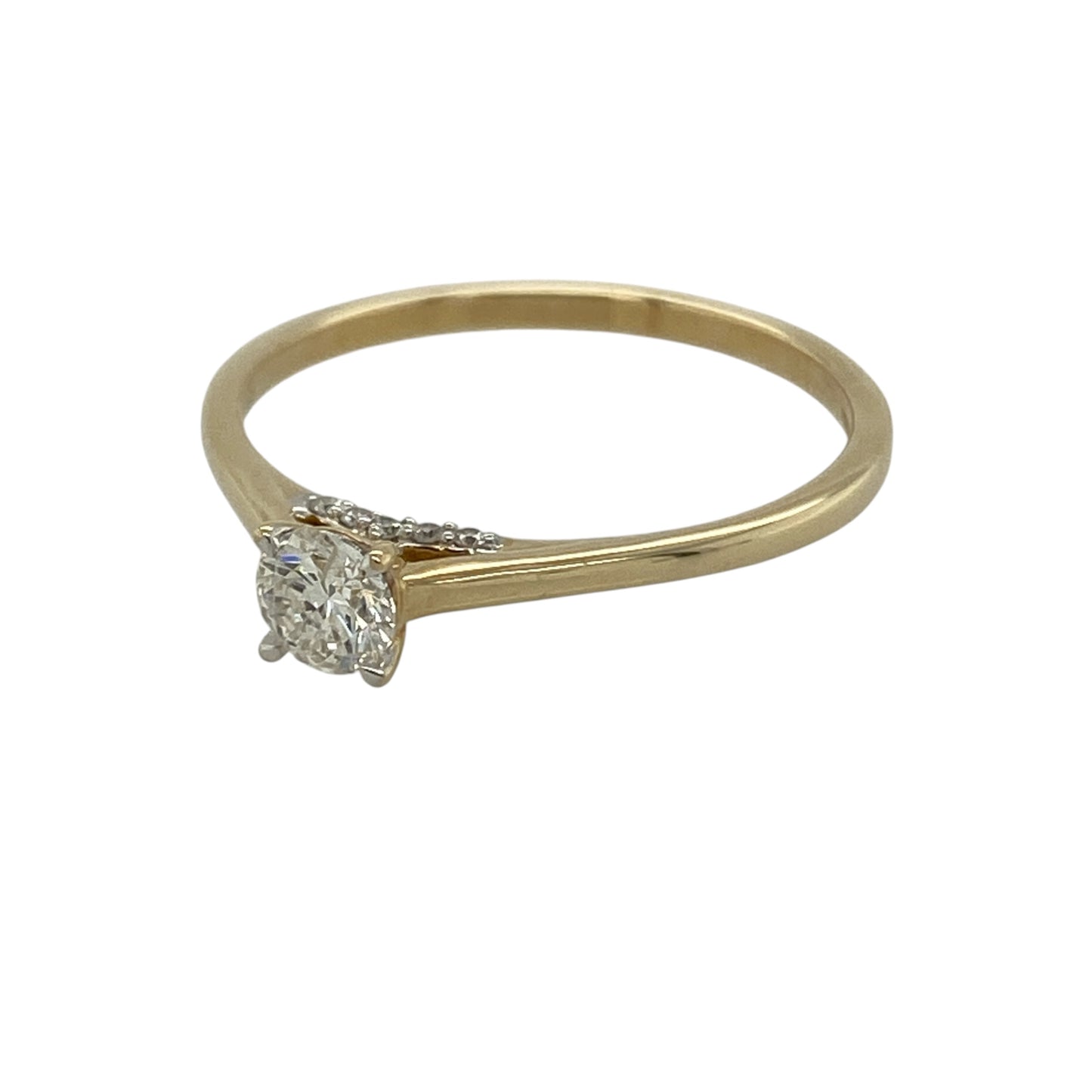 This pre-owned 9ct yellow gold diamond solitaire ring is a timeless design, featuring a brilliant cut diamond with a hidden halo underneath.

Design: Featuring a classic solitaire setting with a hidden halo beneath the centre stone, this ring combines a traditional design with additional diamond detailing in warm 9ct yellow gold.
Material: Made from 9-carat yellow gold.
Gemstone Detail: Brilliant cut centre diamond measuring approximately 0.30ct with a hidden diamond halo underneath.