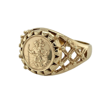 This pre-owned 9ct yellow gold St Christopher coin-style ring is a distinctive traditional design, featuring a St Christopher motif with decorative open shoulders.

Design: Featuring a coin-style St Christopher motif at the centre, this ring has open basket-style detailing along the shoulders and is finished in warm 9ct yellow gold.
Material: Made from 9-carat yellow gold.
Ring Detail: Front of the ring measures approximately 13mm high with open basket-style shoulders.