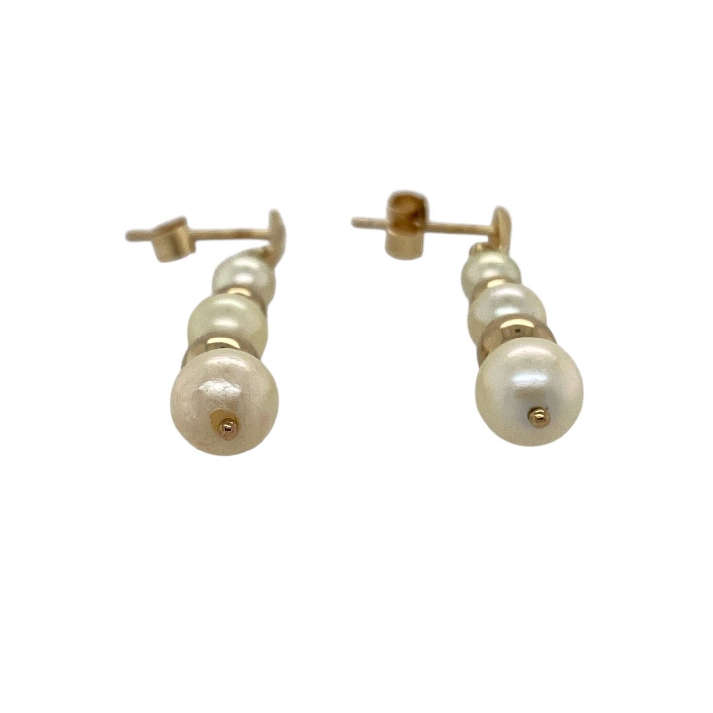 These pre-owned 9ct yellow gold pearl drop earrings are a classic design, featuring three pearls on each earring with decorative gold ball detailing.

Design: Featuring a drop design with three pearls separated by two gold balls on each earring, these earrings combine soft pearl tones with warm 9ct yellow gold.
Material: Made from 9-carat yellow gold.
Gemstone Detail: Each earring is set with three pearls.
Earring Detail: Pearl drop design with two yellow gold balls positioned between the pearls.
