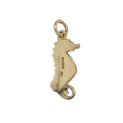 This pre-owned 9ct yellow gold ruby seahorse pendant is a distinctive sea-inspired design, featuring ruby detailing in warm yellow gold.

Design: Featuring a decorative seahorse design with ruby detailing, this pendant is finished in warm 9ct yellow gold.
Material: Made from 9-carat yellow gold.
Gemstone Detail: Set with ruby detailing.
Pendant Detail: Seahorse pendant with a bail measuring approximately 4mm in diameter.
Size & Weight: Total weight 1.80 grams.