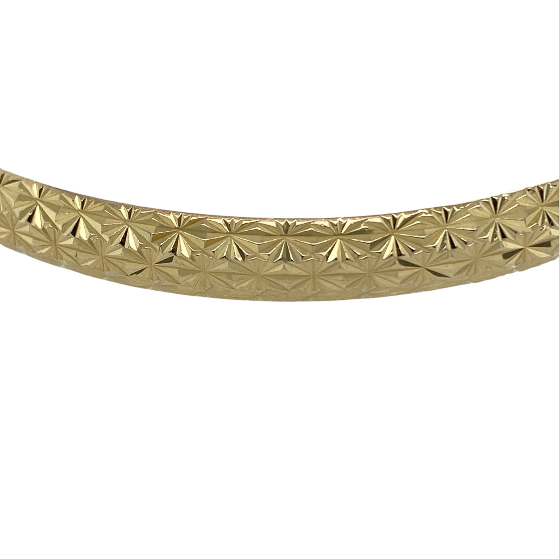 This pre-owned 9ct yellow gold patterned bangle is a classic decorative design, featuring patterned detailing throughout.

Design: Featuring a patterned design, this bangle has a decorative finish in warm 9ct yellow gold.
Material: Made from 9-carat yellow gold.
Bangle Detail: Bangle measures approximately 6mm wide with a diameter of approximately 6.5cm.
Size & Weight: Total weight 6.80 grams.
