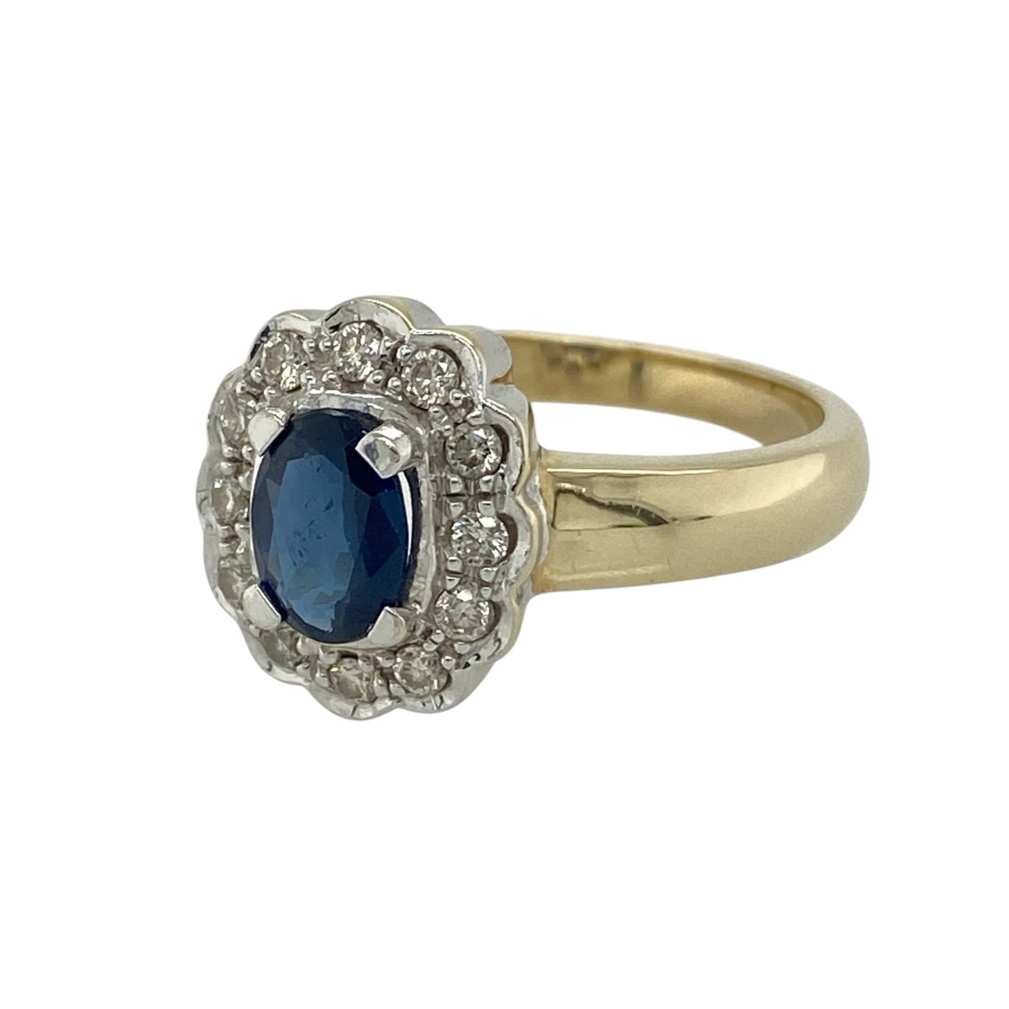 This pre-owned 9ct yellow gold diamond and sapphire cluster ring is a classic gemstone design, featuring an oval sapphire surrounded by diamonds set in contrasting white gold.

Design: Featuring an oval sapphire centre stone surrounded by a cluster of white gold set diamonds, this ring combines rich blue tones with warm 9ct yellow gold and contrasting white gold detailing.
Material: Made from 9-carat yellow gold with white gold diamond settings.