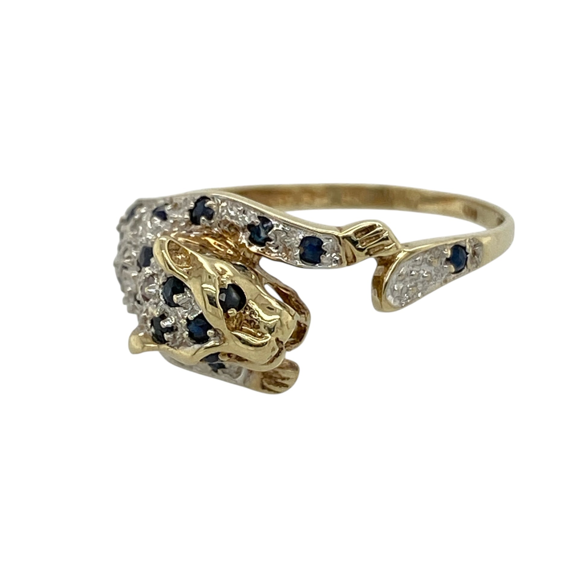 This pre-owned 9ct yellow and white gold diamond and sapphire leopard wrap around ring is a distinctive animal-inspired design, featuring gemstone detailing in contrasting gold tones.

Design: Featuring a leopard-inspired wrap around design, this ring combines warm yellow gold with contrasting white gold, sapphire and diamond detailing.
Material: Made from 9-carat yellow and white gold.
Gemstone Detail: Set with sapphires and diamonds.