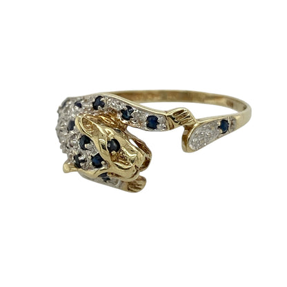 This pre-owned 9ct yellow and white gold diamond and sapphire leopard wrap around ring is a distinctive animal-inspired design, featuring gemstone detailing in contrasting gold tones.

Design: Featuring a leopard-inspired wrap around design, this ring combines warm yellow gold with contrasting white gold, sapphire and diamond detailing.
Material: Made from 9-carat yellow and white gold.
Gemstone Detail: Set with sapphires and diamonds.