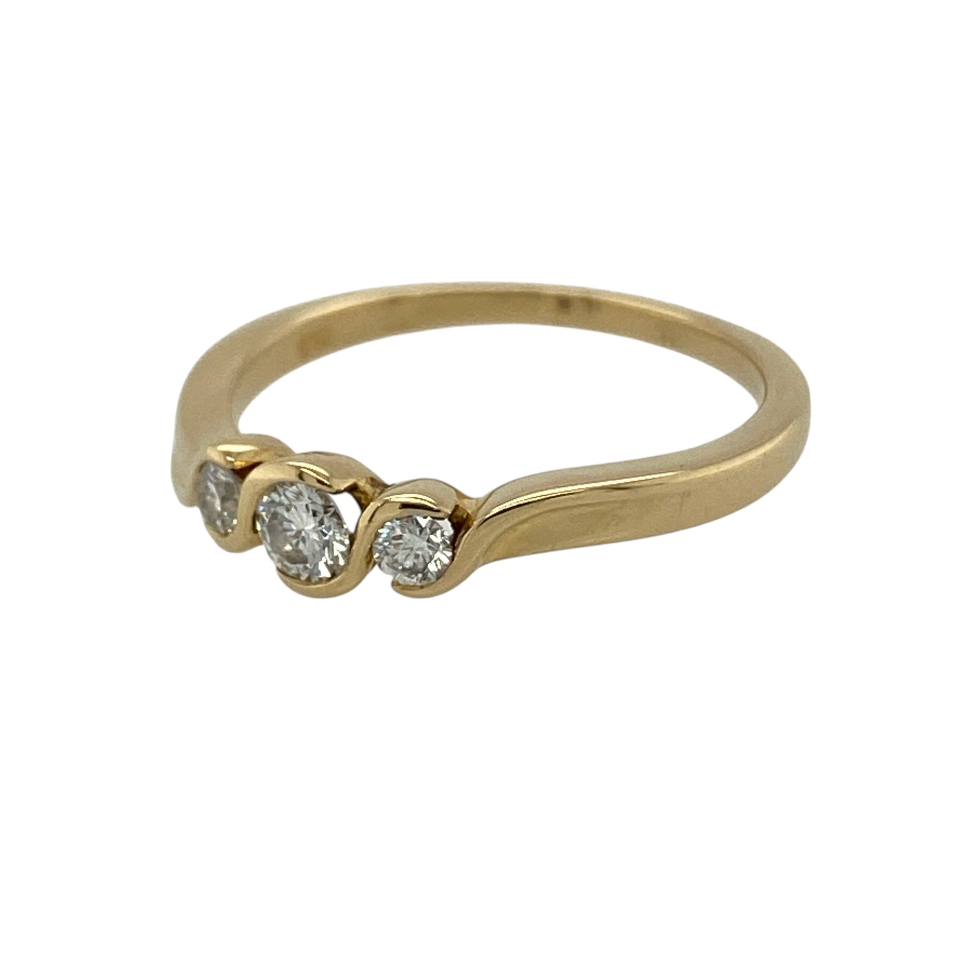 This pre-owned 18ct yellow gold diamond twist trilogy ring is a timeless design, featuring three diamonds within a flowing twist-style setting.

Design: Featuring three diamonds set within a twist-style trilogy design, this ring has a flowing profile finished in warm 18ct yellow gold.
Material: Made from 18-carat yellow gold.
Gemstone Detail: Set with three diamonds.
Ring Detail: Three-stone twist trilogy ring design.
Size & Weight: Ring size M. Total weight 2.80 grams.