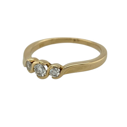 This pre-owned 18ct yellow gold diamond twist trilogy ring is a timeless design, featuring three diamonds within a flowing twist-style setting.

Design: Featuring three diamonds set within a twist-style trilogy design, this ring has a flowing profile finished in warm 18ct yellow gold.
Material: Made from 18-carat yellow gold.
Gemstone Detail: Set with three diamonds.
Ring Detail: Three-stone twist trilogy ring design.
Size & Weight: Ring size M. Total weight 2.80 grams.