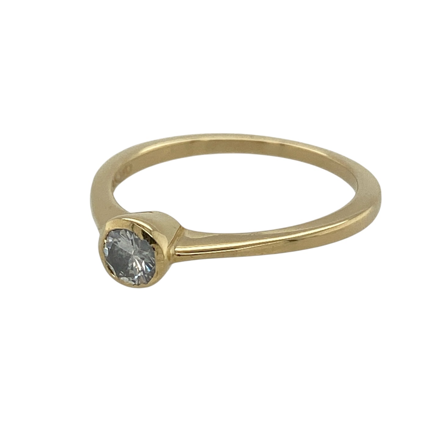 This pre-owned 18ct yellow gold diamond solitaire ring is a timeless design, featuring a brilliant cut diamond in a classic rubover setting.

Design: Featuring a brilliant cut diamond in a rubover solitaire setting, this ring has a classic design finished in warm 18ct yellow gold.
Material: Made from 18-carat yellow gold.
Gemstone Detail: Brilliant cut diamond measuring approximately 0.15ct.
Ring Detail: Classic rubover set solitaire ring design.
Size &amp; Weight: Ring size N. Total weight 2.50 grams.