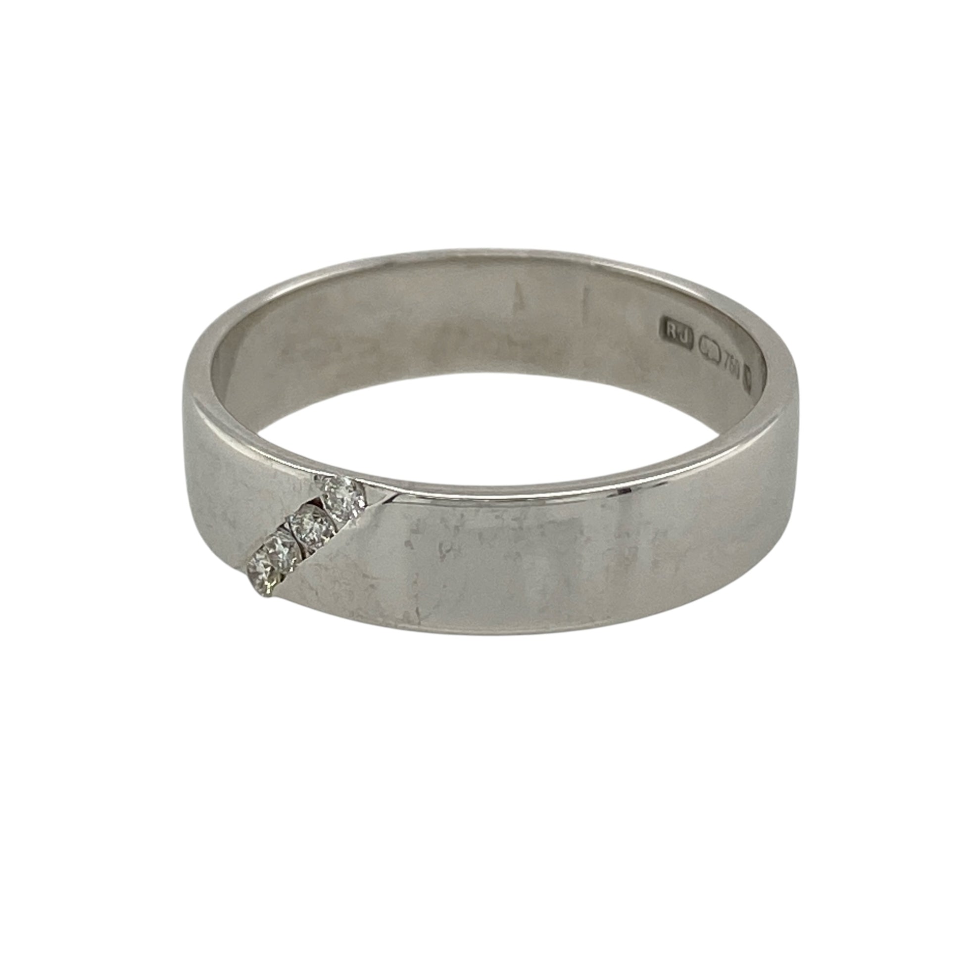 This pre-owned 18ct white gold diamond band ring is a classic design, featuring a diagonal row of four diamonds across the band.

Design: Featuring a wide band with four small diamonds set in a diagonal row, this ring has a simple geometric design finished in 18ct white gold.
Material: Made from 18-carat white gold.
Gemstone Detail: Set with four small diamonds in a diagonal arrangement.
Ring Detail: Band measures approximately 5mm wide.
Size & Weight: Ring size O. Total weight 4.40 grams.