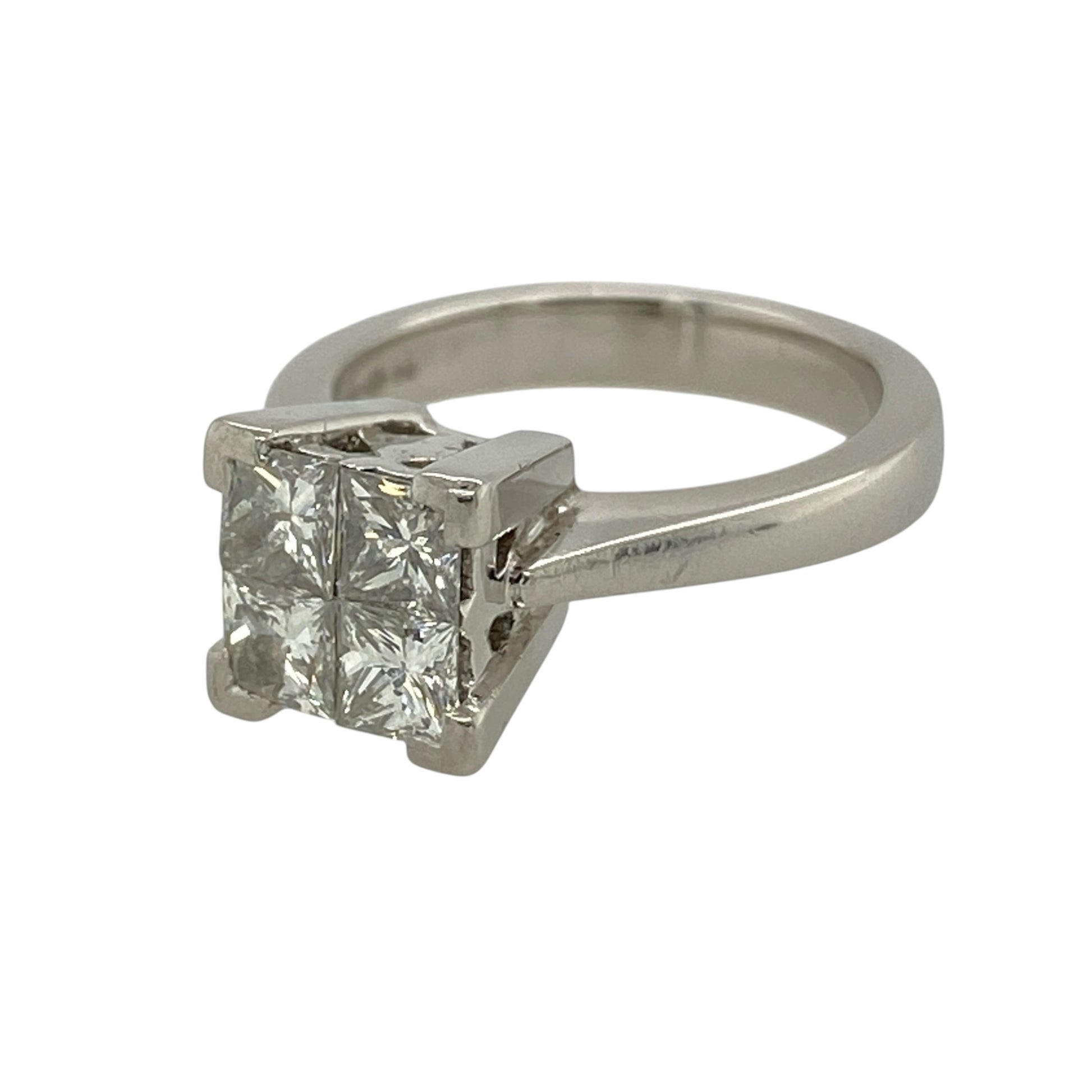 This pre-owned platinum diamond illusion-set solitaire ring is a striking design, featuring four princess cut diamonds arranged together to create the appearance of a larger single stone.

Design: Featuring four princess cut diamonds set closely together in an illusion-style solitaire setting, this ring creates the appearance of a larger centre stone and is finished in platinum.
Material: Made from platinum.
Gemstone Detail: Four princess cut.
