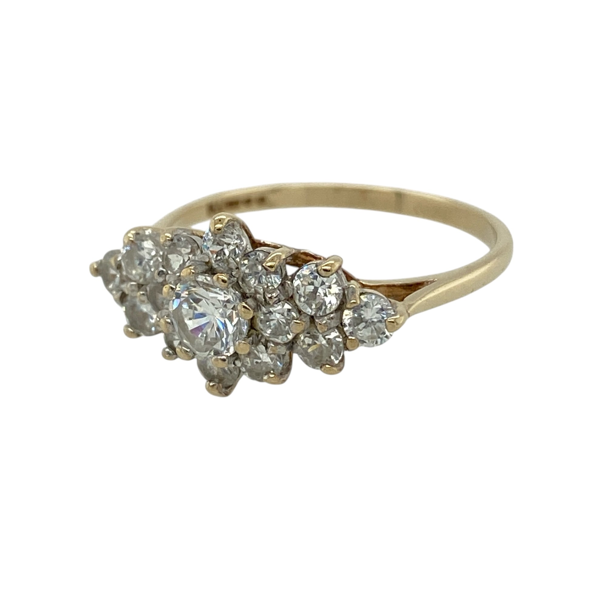 This pre-owned 9ct yellow gold cubic zirconia cluster ring is a classic stone-set design, featuring cubic zirconia stones arranged in a decorative cluster.

Design: Featuring a cluster of cubic zirconia stones across the front, this ring has a classic stone-set design finished in warm 9ct yellow gold.
Material: Made from 9-carat yellow gold.
Gemstone Detail: Set with cubic zirconia stones in a cluster arrangement.
Ring Detail: Front of the ring measures approximately 9mm high.