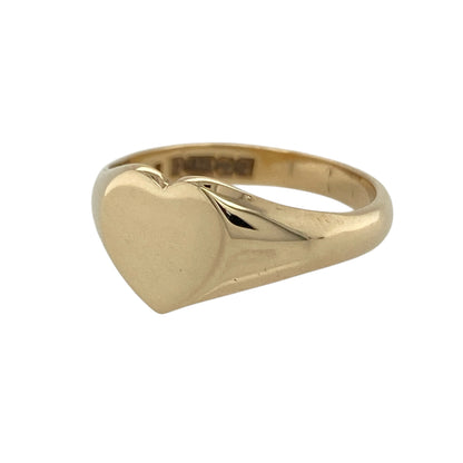 This pre-owned 9ct yellow gold plain polished heart signet ring is a classic design, featuring a simple heart-shaped front.

Design: Featuring a heart-shaped signet face with a plain polished finish, this ring has a timeless design in warm 9ct yellow gold.
Material: Made from 9-carat yellow gold.
Ring Detail: Plain polished heart-shaped front measuring approximately 9mm high.
Size & Weight: Ring size K to L. Total weight 2.40 grams.