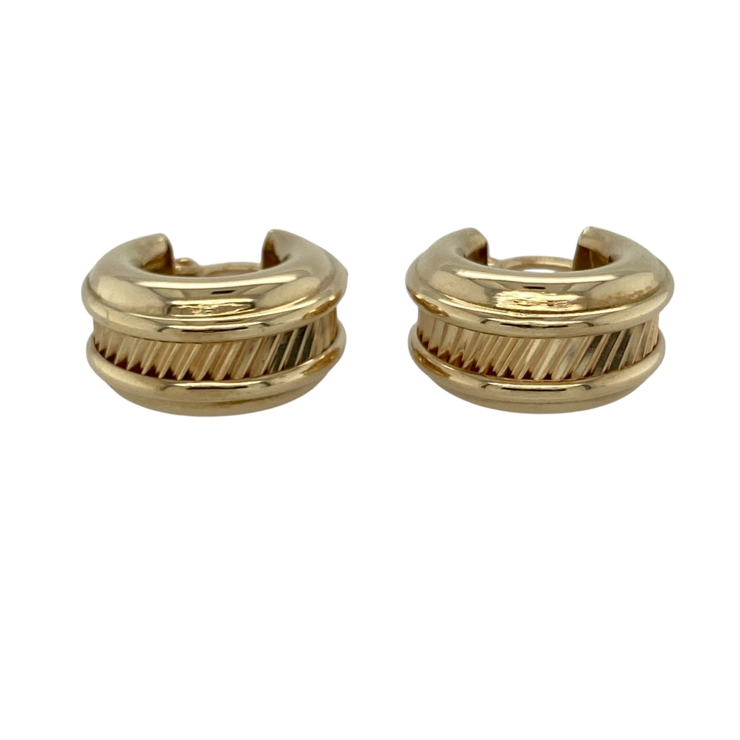 These pre-owned 9ct yellow gold wide textured centre creole earrings are a distinctive design, featuring decorative texture through the centre.

Design: Featuring a wide creole shape with textured detailing through the centre, these earrings have a decorative finish in warm 9ct yellow gold.
Material: Made from 9-carat yellow gold.
Earring Detail: Wide creole design with a textured centre.
Size & Weight: Total weight 2.70 grams.