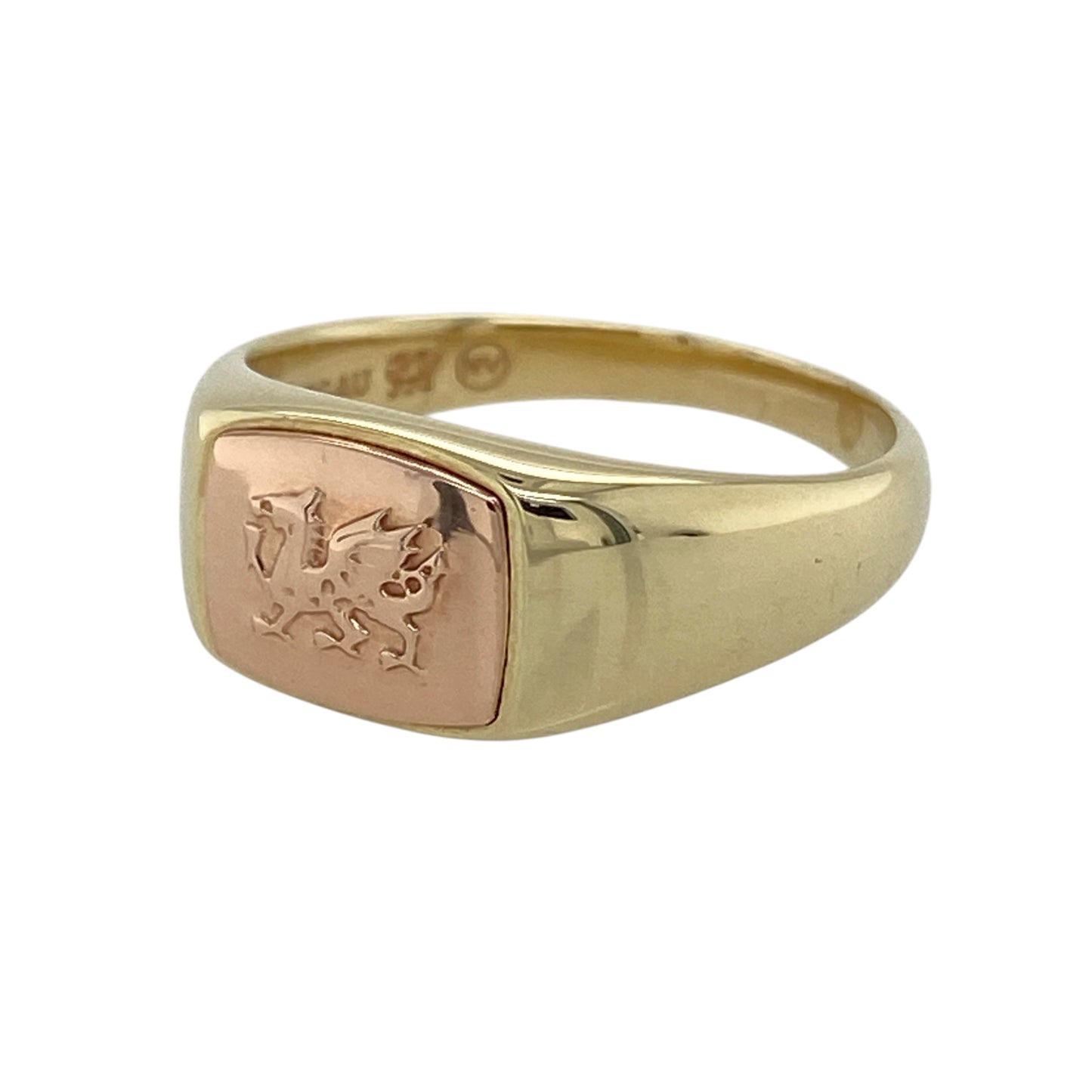 Bring bold heritage and refined two-tone style to your collection with this pre-owned 9ct yellow and rose gold Clogau Welsh Dragon signet ring—an iconic piece celebrating Welsh identity and craftsmanship.

Design: This traditional signet ring features an 9mm-high front engraved with the legendary Welsh Dragon, offering strong symbolism and striking detail. The combination of yellow and rose gold adds depth and contrast, giving the ring a distinctive and polished appearance.