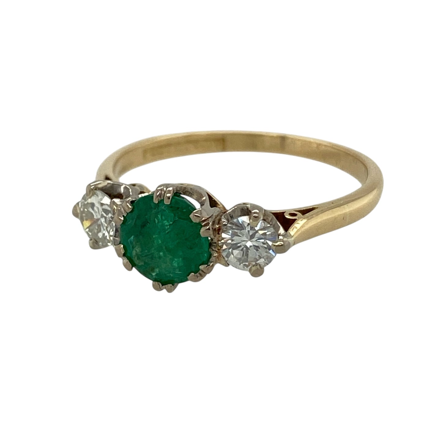 This pre-owned 18ct yellow gold diamond and emerald trilogy ring is a classic gemstone design, featuring a vibrant emerald centre stone with diamond detailing.

Design: Featuring a trilogy design with a round emerald at the centre and diamonds set on either side, this ring combines rich green tones with the warm finish of 18ct yellow gold.
Material: Made from 18-carat yellow gold.
Gemstone Detail: Centre emerald stone measuring approximately 6mm in diameter, with a diamond set on either side.