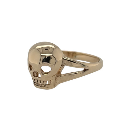 This pre-owned 9ct yellow gold skull ring is a distinctive statement design, featuring a detailed skull motif in warm yellow gold.

Design: Featuring a skull-shaped design across the front, this ring has a bold and distinctive appearance finished in warm 9ct yellow gold.
Material: Made from 9-carat yellow gold.
Ring Detail: Skull design measuring approximately 11mm high across the front.
Size & Weight: Ring size L. Total weight 2.10 grams.