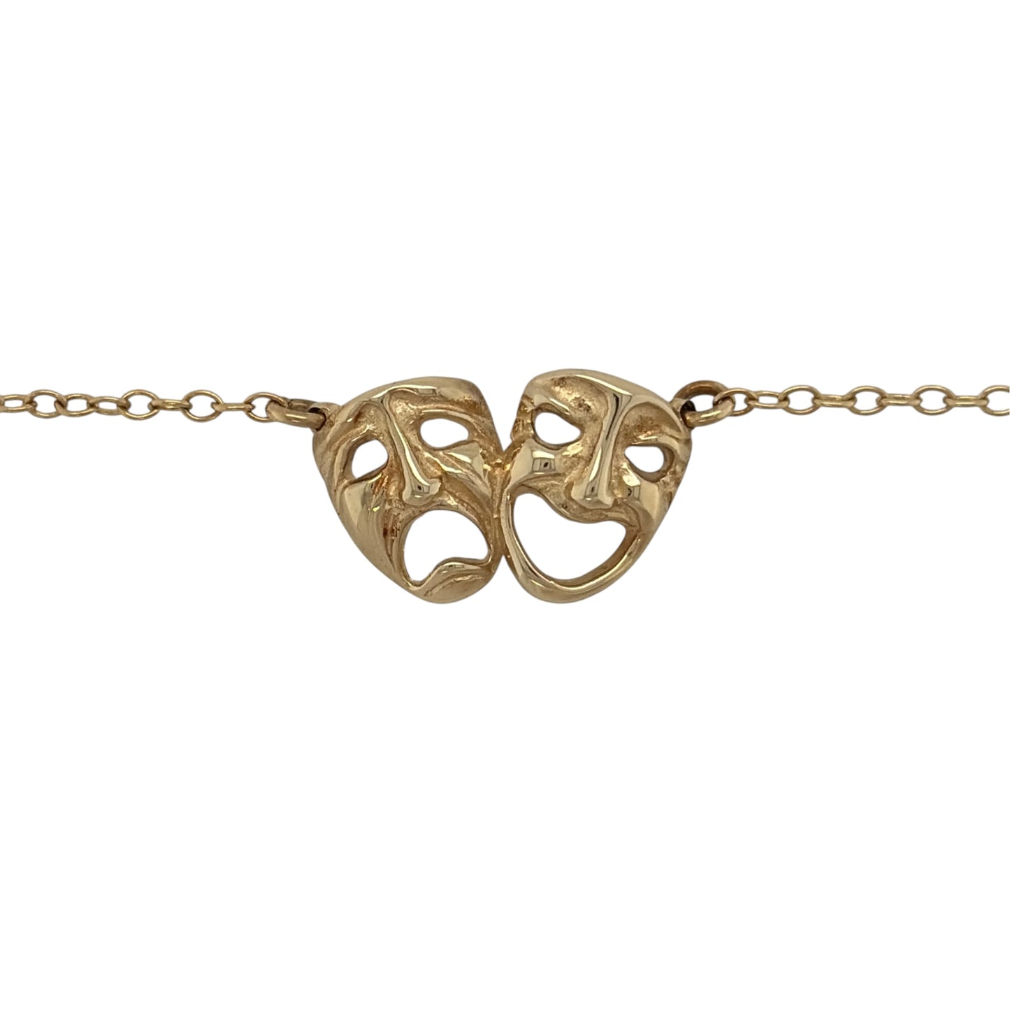 This pre-owned 9ct yellow gold comedy and tragedy theatre faces necklace is a distinctive design, featuring the iconic theatrical masks representing comedy and tragedy.

Design: Featuring the traditional comedy and tragedy theatre face motifs, this necklace has a distinctive performing arts-inspired design finished in warm 9ct yellow gold.
Material: Made from 9-carat yellow gold.
Necklace Detail: Features the iconic comedy and tragedy theatre masks.