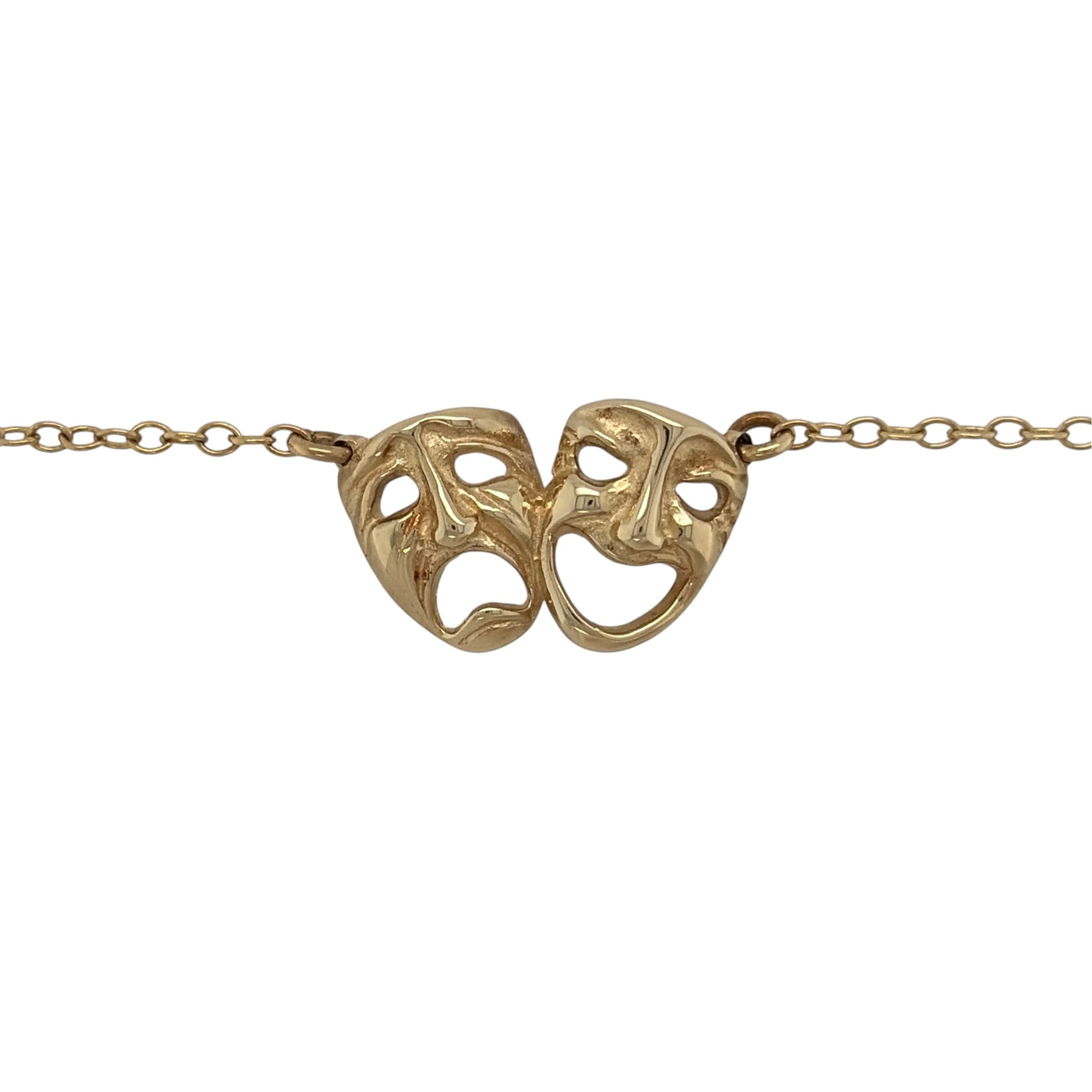 This pre-owned 9ct yellow gold comedy and tragedy theatre faces necklace is a distinctive design, featuring the iconic theatrical masks representing comedy and tragedy.

Design: Featuring the traditional comedy and tragedy theatre face motifs, this necklace has a distinctive performing arts-inspired design finished in warm 9ct yellow gold.
Material: Made from 9-carat yellow gold.
Necklace Detail: Features the iconic comedy and tragedy theatre masks.