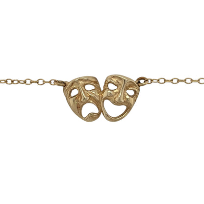 This pre-owned 9ct yellow gold comedy and tragedy theatre faces necklace is a distinctive design, featuring the iconic theatrical masks representing comedy and tragedy.

Design: Featuring the traditional comedy and tragedy theatre face motifs, this necklace has a distinctive performing arts-inspired design finished in warm 9ct yellow gold.
Material: Made from 9-carat yellow gold.
Necklace Detail: Features the iconic comedy and tragedy theatre masks.