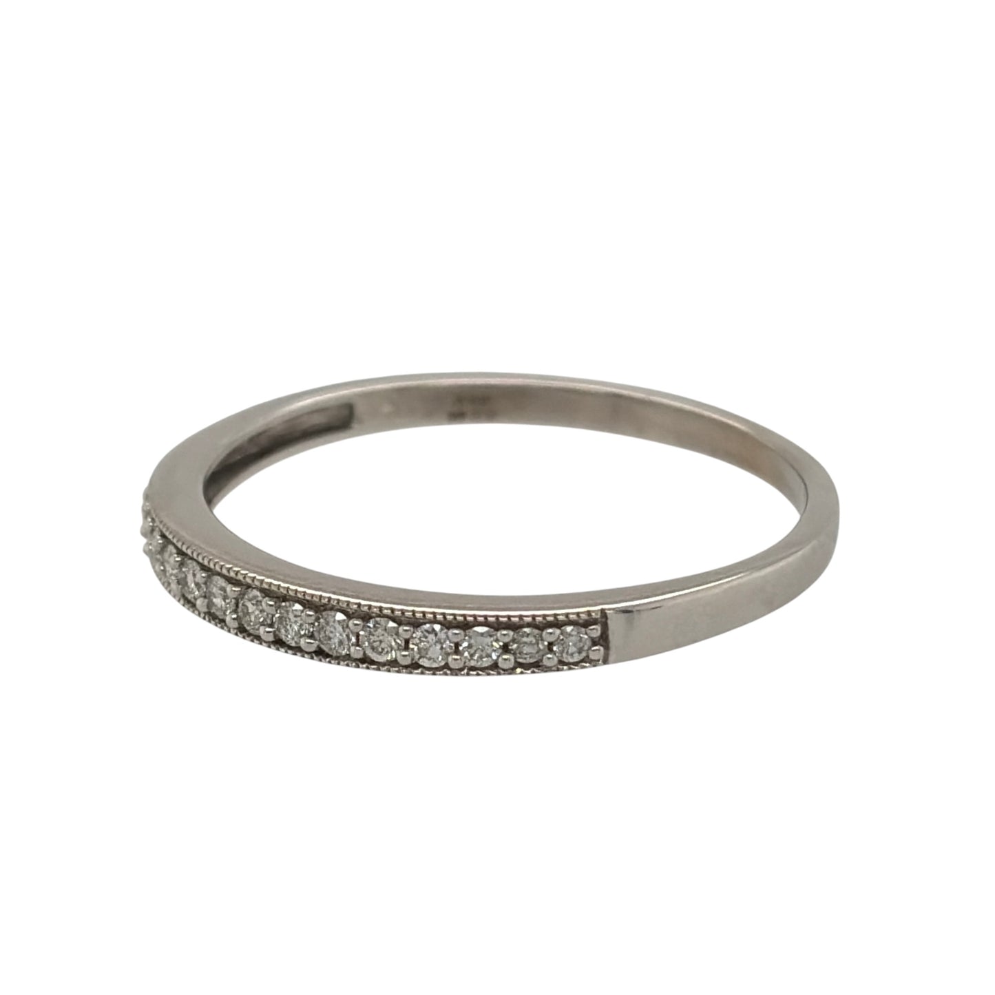 This pre-owned 9ct white gold diamond band ring is a classic design, featuring diamond detailing set across the front of the band.

Design: Featuring a simple band design with diamonds set across the front, this ring has a clean and timeless finish in 9ct white gold.
Material: Made from 9-carat white gold.
Gemstone Detail: Set with approximately 0.20ct of diamond content in total.
Ring Detail: The front of the band measures approximately 2.5mm wide.
Size & Weight: Ring size Z. Total weight 2.30 grams.